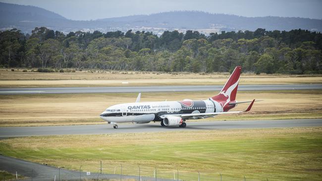 A qantas passenger plane with indigenous artwork departs Hobart Airport. Picture: RICHARD JUPE File / generic / travel / departure / Hobart Airport