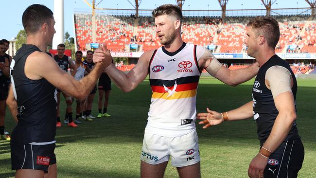 Bryce Gibbs with his former Carlton teammates Kade Simpson and Marc Murphy following his final AFL game. Picture: Michael Klein