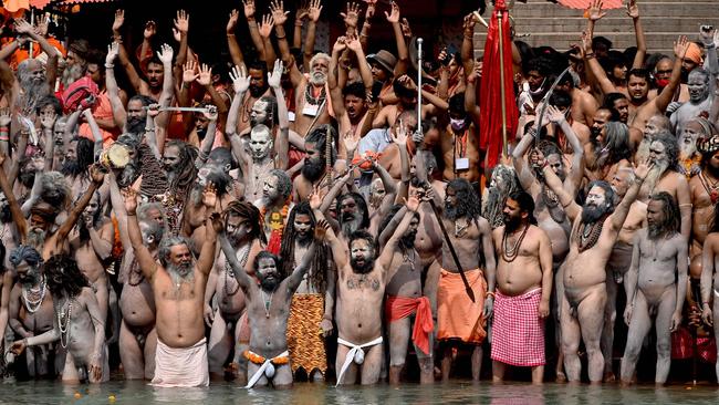 Naga Sadhus (Hindu holy men) take a holy dip in the waters of the Ganges River on the day of Shahi Snan (royal bath) during the Kumbh Mela festival, in Haridwar. Picture: AFP.