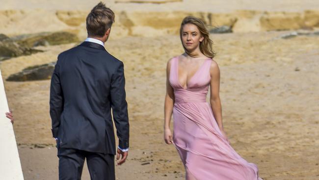 Sydney Sweeney and Glen Powell film a windswept romantic scene for their new untitled rom-com at Maroubra Beach. Picture: Media Mode.