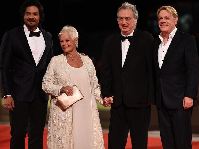 After seeing his work on screen in Victoria &amp; Abdul, Izzard finally felt worthy of standing alongside co-stars Ali Fazal and Judi Dench and director Stephen Frears on the Venice International Film Festival red carpet. Picture: Ian Gavan/Getty Images