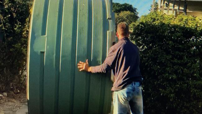 Malcolm pushed a water tank down the streets of Murtoa.