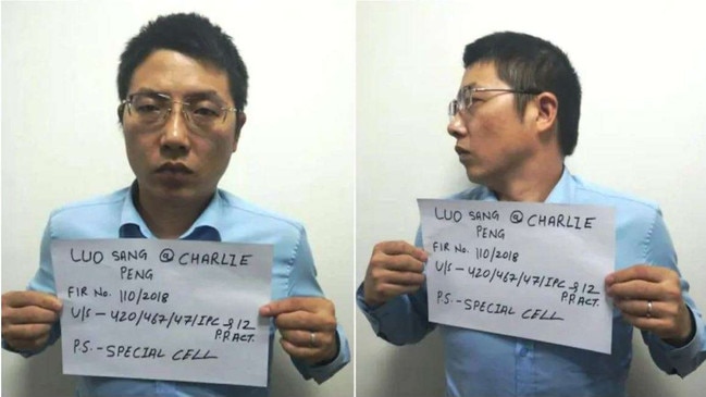 Luo Sang is booked after his arrest on money laundering charges on August 12, 2020.