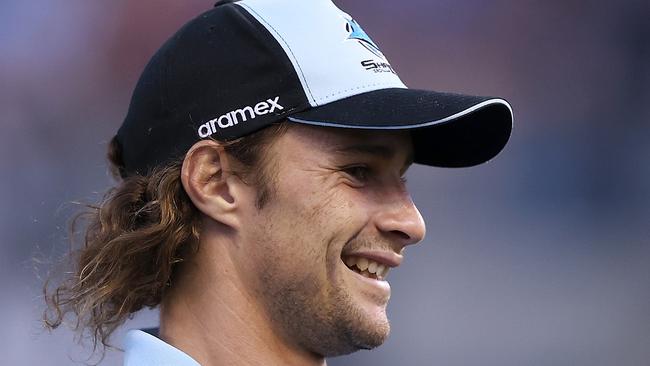 PENRITH, AUSTRALIA - MARCH 04: Injured Sharks player Nicho Hynes watches on during the warm-up before during the round one NRL match between Cronulla Sharks and South Sydney Rabbitohs at BlueBet Stadium on March 04, 2023 in Cronulla, Australia. (Photo by Mark Kolbe/Getty Images)