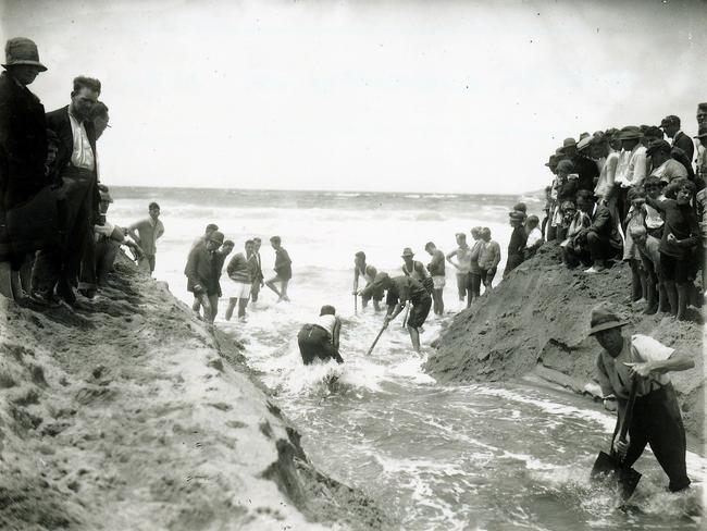 The entrance of Narrabeen Lagoon being opened in the 1920s to prevent flooding. Photo courtesy State Library of NSW