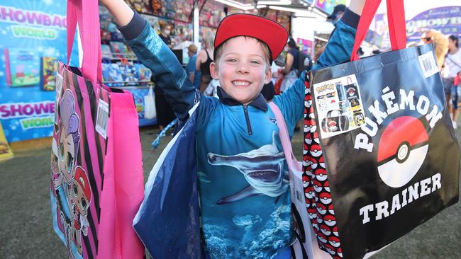 All the fun at the Gold Coast Show, big crowds flock to Sideshow Alley on the first day. Elijah Mitchley 5 from Coomera loves sample bags. Picture: Glenn Hampson