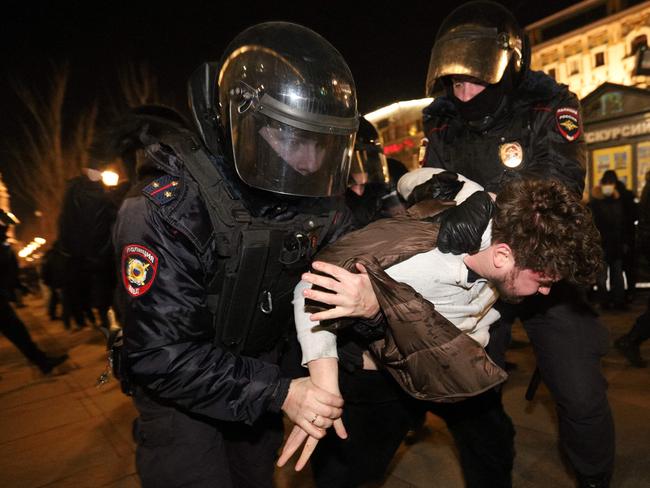 Police officers detain a demonstrator during a protest against Russia's invasion of Ukraine. Picture: AFP