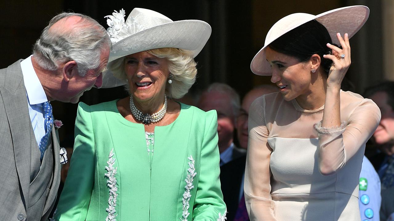 Prince Charles, Camilla Parker Bowles and Meghan Markle enjoying the garden party in May 2018. Picture: AFP PHOTO / POOL / Dominic Lipinski.