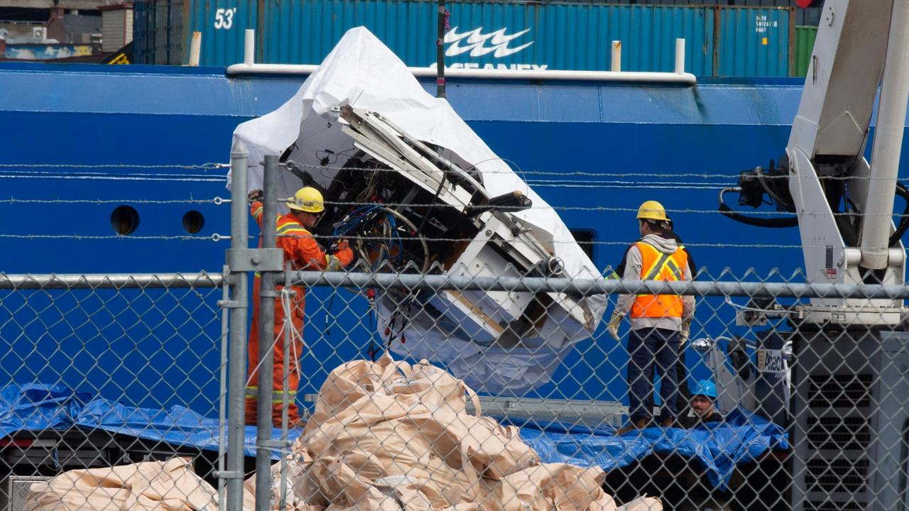 Debris from the Titan submersible, recovered from the ocean floor near the wreck of the Titanic is unloaded from the ship Horizon Arctic. Picture: Canadian Press/Shutterstock