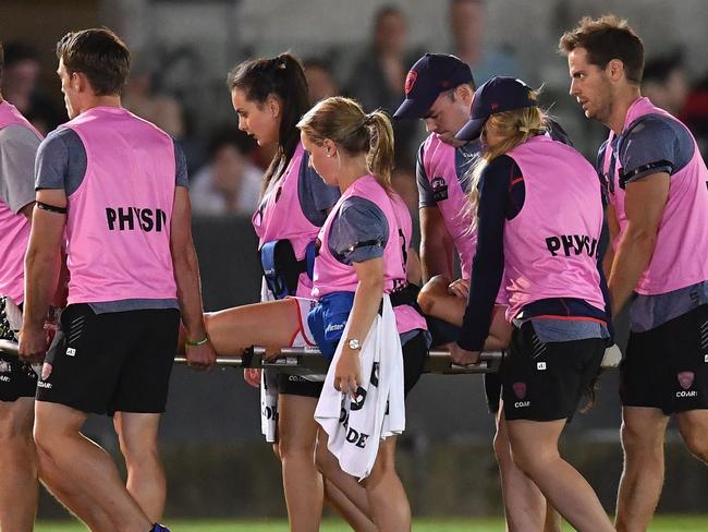 MELBOURNE, AUSTRALIA - FEBRUARY 11: Meg Downie of the Demons is stretchered off the ground during the round two AFL Women's match between the Collingwood Magpies and the Melbourne Demons at Ikon Park on February 11, 2017 in Melbourne, Australia. (Photo by Quinn Rooney/Getty Images)