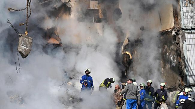 Rescuers search for survivors in the rubble of a damaged residential building in Uman. Picture: AFP