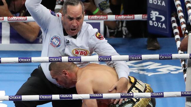 Referee Phil Austin calls off the fight after Anthony Mundine is knocked down in the first round. Picture: Peter Wallis