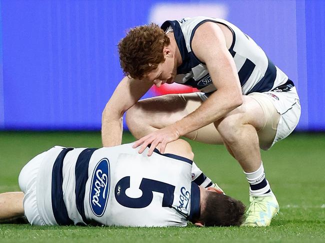 GEELONG, AUSTRALIA - JUNE 22: Jeremy Cameron of the Cats and Gary Rohan of the Cats are seen as  Cameron lays injured during the 2023 AFL Round 15 match between the Geelong Cats and the Melbourne Demons at GMHBA Stadium on June 22, 2023 in Geelong, Australia. (Photo by Michael Willson/AFL Photos via Getty Images)