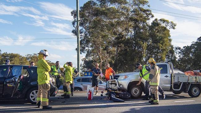 A man is in hospital after his motorbike became lodged under a ute. Picture: Nigel Hallett