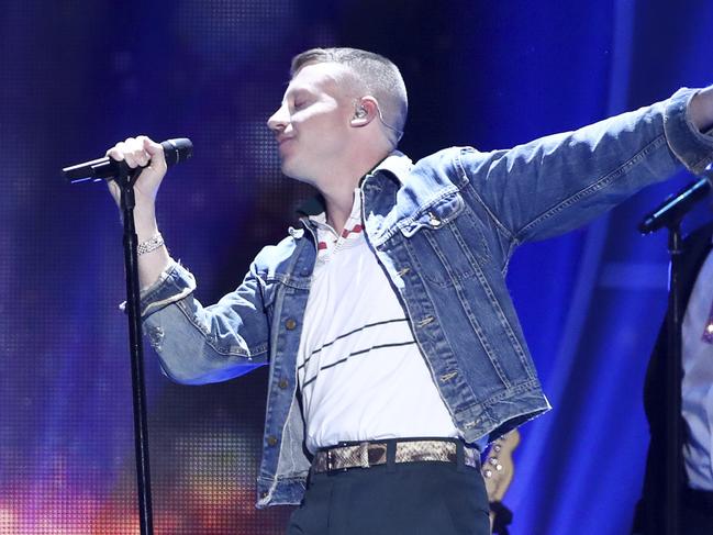 In this Sept. 23, 2017, file photo, Macklemore performs at the 2017 iHeartRadio Music Festival in Las Vegas. U.S. rapper Macklemore is wading into Australia's gay-marriage debate by vowing to sing his marriage equality anthem 