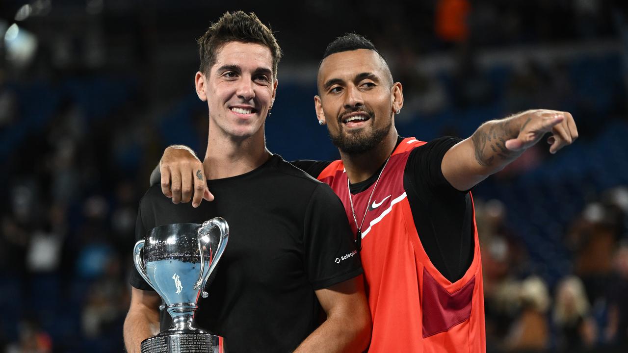 MELBOURNE, AUSTRALIA - JANUARY 29: Thanasi Kokkinakis (L) of Australia and Nick Kyrgios of Australia pose with the championship trophy after winning their Men's DoublesÂ Final match against Matthew Ebden of Australia and Max Purcell of Australia during day 13 of the 2022 Australian Open at Melbourne Park on January 29, 2022 in Melbourne, Australia. (Photo by Quinn Rooney/Getty Images)