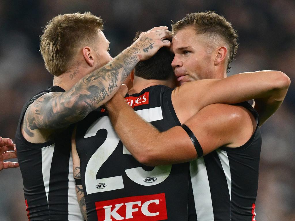 Crisp was immediately comforted by his teammates. Picture: Quinn Rooney/Getty Images