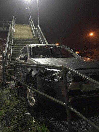 A woman has driven her car up and over a pedestrian overpass at Kananook railway station. Picture: Victoria Police