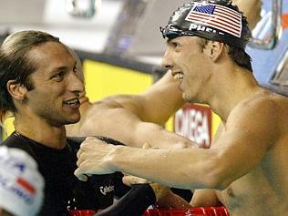  JULY 25, 2003 : Second placed Ian Thorpe (L) congratulates winner Michael Phelps after he set new world record in men's 200 ...