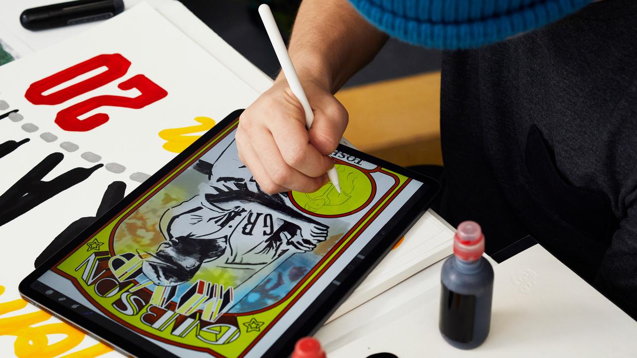 Artist Eric “Efdot” Friedensohn works on a Josh Gibson baseball card using his iPad Pro and Apple Pencil. Picture: Apple.