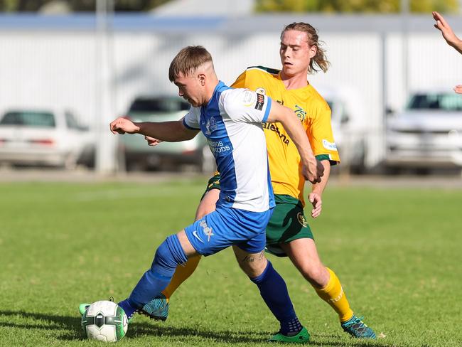 Cumberland United’s Karl Phelps (in yellow) scored in his side’s FFA Cup loss to Adelaide Olympic. Picture: Adam Butler