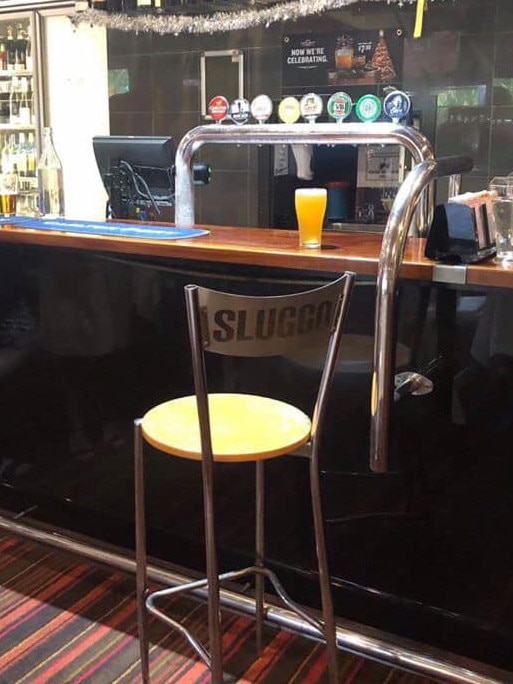 Family and friends farewelled popular businessman and former Wanderers football club president Steve Olsson. Sluggo's empty seat at the bar of his drinking hole the Darwin Airport Tavern and a final beer were a fitting tribute at his wake. Picture: FACEBOOK