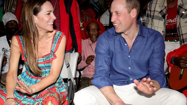 William and Kate play the drums during a visit to Trench Town Culture Yard Museum where Bob Marley used to live in Kingston. Picture: Getty Images.