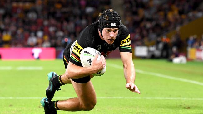 BRISBANE, AUSTRALIA - APRIL 15: Matt Burton of the Panthers scores a try during the round six NRL match between the Brisbane Broncos and the Penrith Panthers at Suncorp Stadium, on April 15, 2021, in Brisbane, Australia. (Photo by Bradley Kanaris/Getty Images)