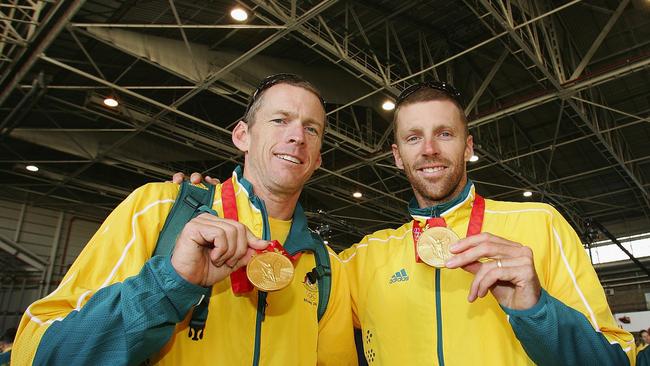 Duncan Free, left, and Drew Ginn pose with their Olympic gold medals in 2008. Picture: Matt King/Getty Images