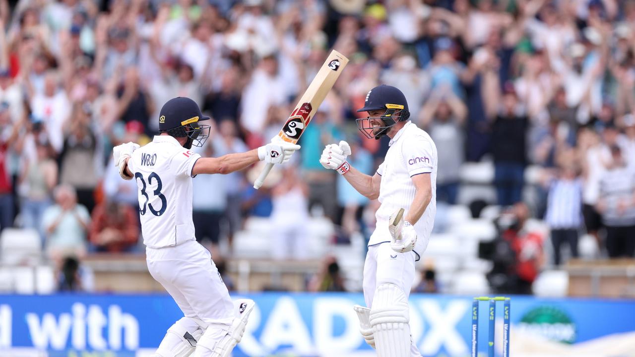 Elation: Chris Woakes (R) celebrates hitting the winning runs with teammate Mark Wood. Picture: Getty