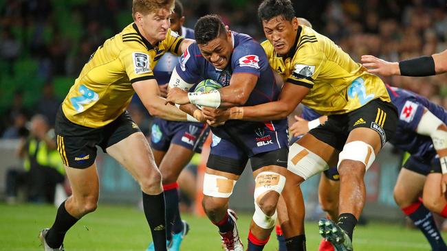 Rebels No 8 Amanaki Mafi takes on the Hurricanes defence in a rampaging first-half performance on Friday night. Picture: Getty Images