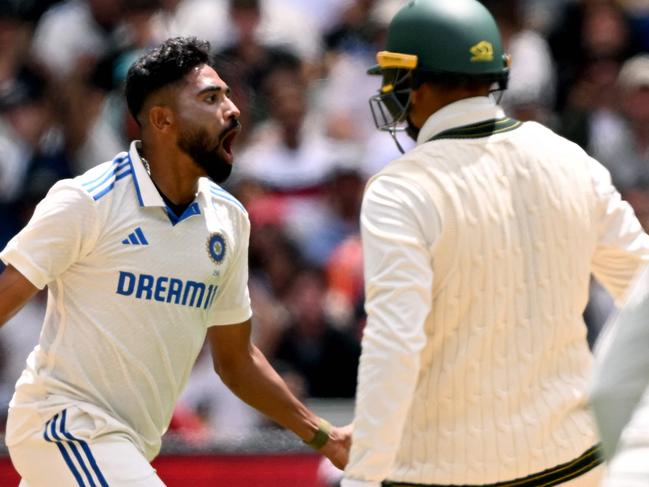 Indian bowler Mohammed Siraj celebrates with teammates after dismissing Australian batsman Usman Khawaja (R) on the fourth day of the fourth cricket Test match between Australia and India at the Melbourne Cricket Ground (MCG) in Melbourne on December 29, 2024. (Photo by William WEST / AFP) / -- IMAGE RESTRICTED TO EDITORIAL USE - STRICTLY NO COMMERCIAL USE --