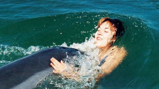 Melody: “Being propelled backwards by a powerful dolphin is an unnerving experience. But, somehow, I knew Jock wouldn’t hurt me. His strength was amazing and, when he wanted to play this game, all I could do was let it happen!” Picture: Mike Bossley