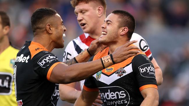 Michael Chee-Kam and Tu'imoala Lolohea of the Tigers celebrate Lolohea scoring a try.