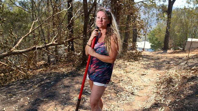 Belinda Pearl and her dog Gucci came close to losing everything when flames came perilously close to their Canungra home during recent fires. Pics Adam Heads