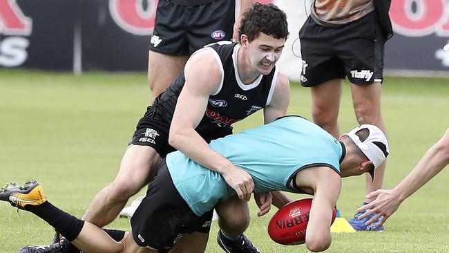 Port Adelaide’s Darcy Byrne-Jones tackles teammate Connor Rozee at Power training. Picture SARAH REED