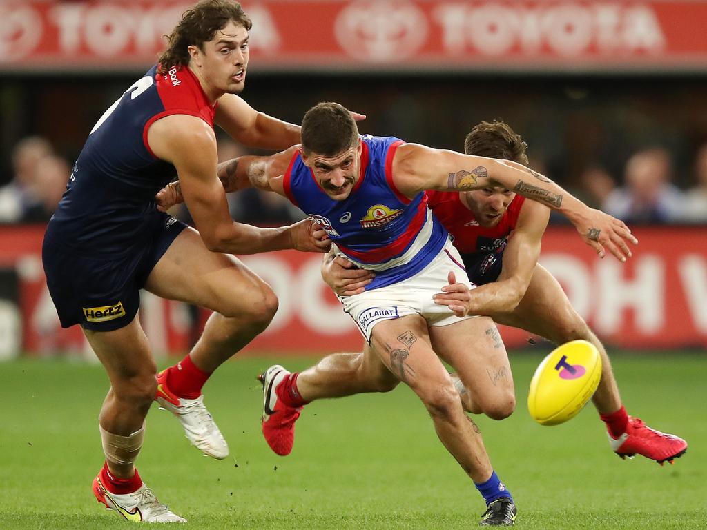 Bulldog Tom Liberatore battles for the ball against Luke Jackson. Picture: Gary Day/AFL Photos via Getty Images