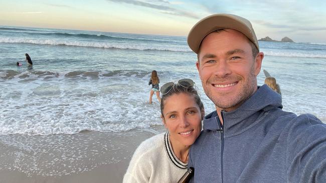 Chris Hemsworth and Elsa Pataky with their kids in the background in Byron. Picture: Instagram