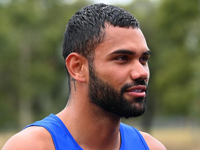 MELBOURNE, AUSTRALIA - FEBRUARY 27: Tarryn Thomas of the Kangaroos walks off the training track with his team mates during a North Melbourne Kangaroos AFL media opportunity at Arden Street Ground on February 27, 2023 in Melbourne, Australia. (Photo by Quinn Rooney/Getty Images)