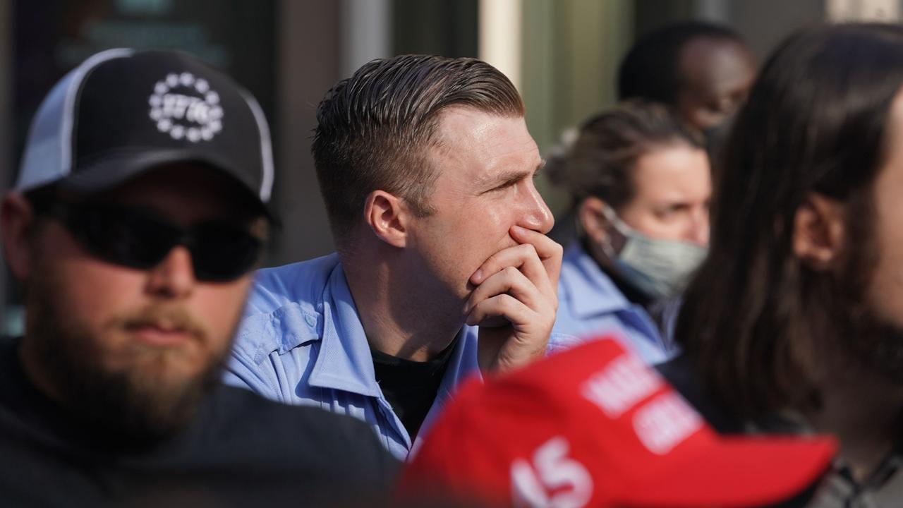 Trump supporters appear pensive after learning of his loss. Picture: Bryan R. Smith / AFP