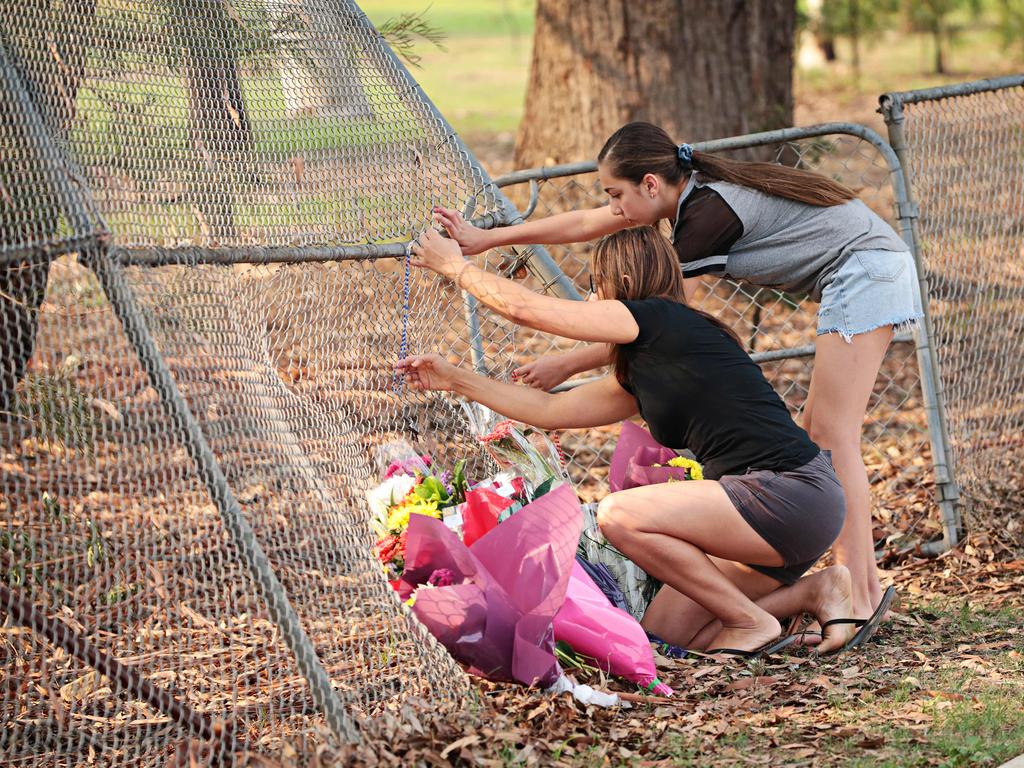 Mourners flocked to the crash site. Picture: Adam Yip