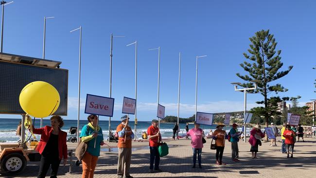 Local artists protest over fears funding could be cut for the planned coastal walk arts trail from Manly to Palm Beach. Picture: Madelaine Wong