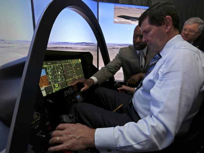 In the firing line ... Minister for Defence Kevin Andrews looks over a Lockheed Martin, F-35 Lightning II, Cockpit Demonstrator. Source: Defence