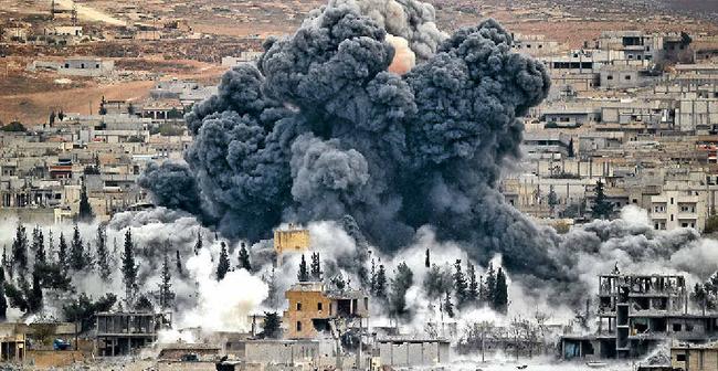 AIR STRIKE: Smoke rises from the Syrian city of Kobani. Picture: Vadim Ghirdaap