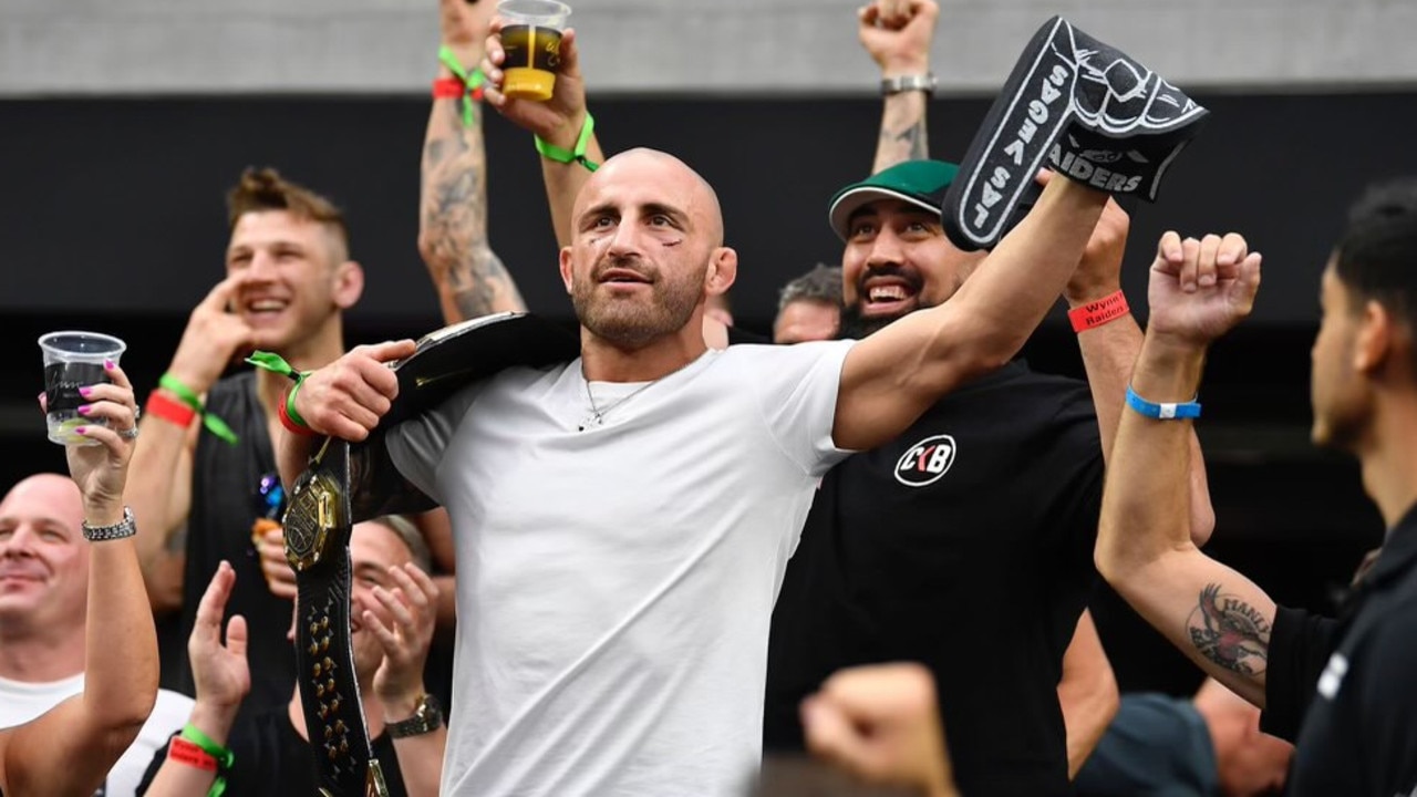 UFC champ Alex Volkanovski celebrates after defending his title against Brian Ortega at UFC 266.