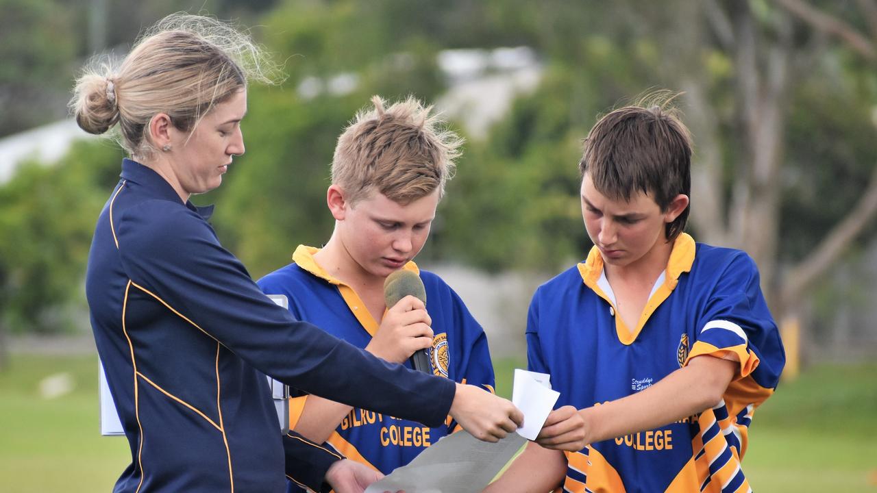 Gilroy teacher Maddyn White with students Grant Martin and Connor Matsen read a touching poem by Jonny Pearce, ‘<i>The Will Murdoch Perpetual Shield</i>’. Picture: Cameron Bates