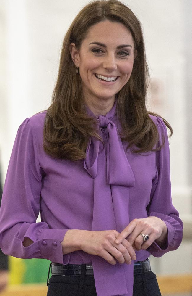 Catherine, Duchess of Cambridge visits the Henry Fawcett Children's Centre in London on March 12, 2019 where her purple blouse became the centre of confusion — as fashion fans spotted she wore her top back-to-front. Picture: Arthur Edwards