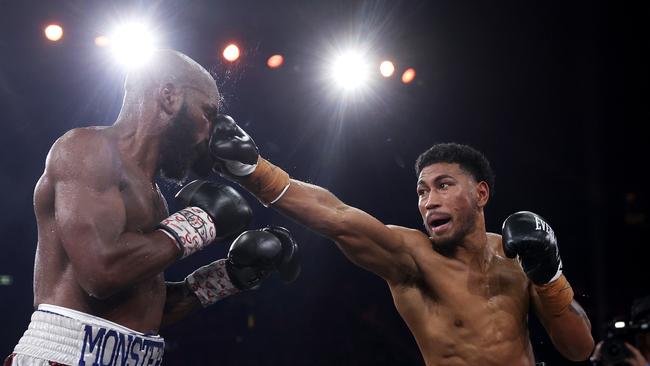 Yunieski Gonzalez is punched by Paulo Aokuso during the light heavyweight bout at Qudos Bank Arena. Picture: Mark Kolbe/Getty Images