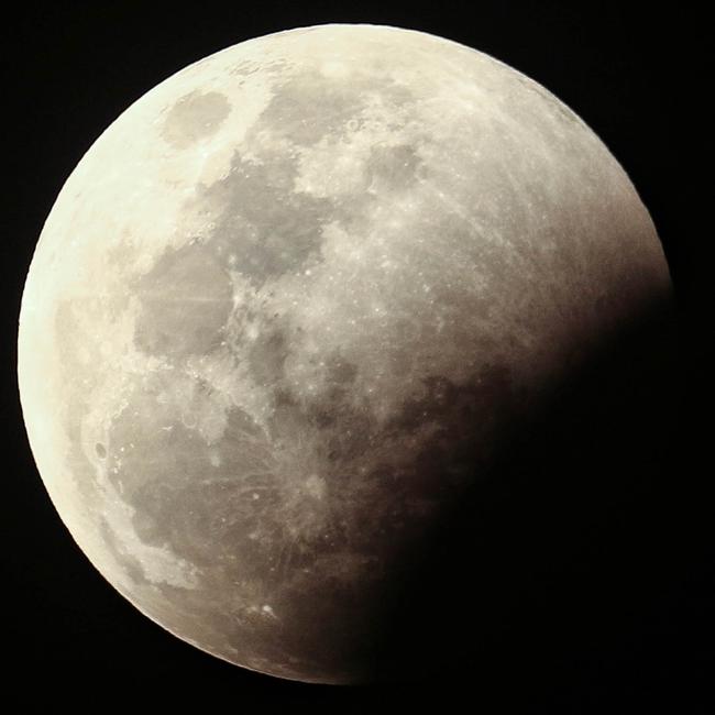 The super blood full moon seen over Darwin on Wednesday night. Pictures: Glenn Campbell