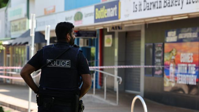 NT Police officer outside the Nightcliff Friendly Grocer the day after the alleged murder of store owner Linford Feick. Picture: Pema Tamang Pakhrin